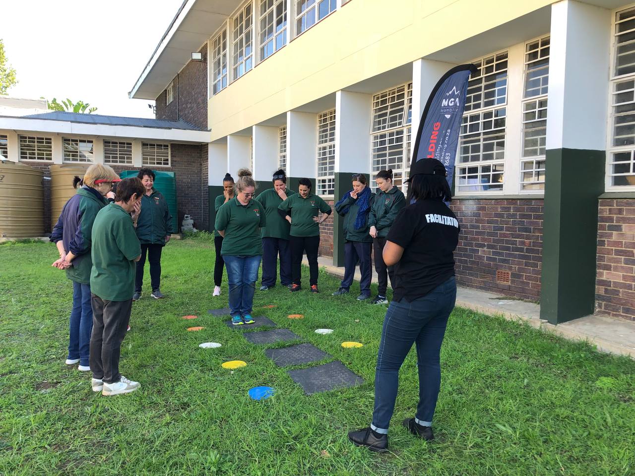 An MGA facilitator briefing a workplace team before a pathway activity